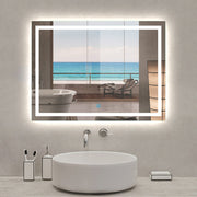 LED bathroom mirror with demister – bathroom installation view with mirror turned on, showing clear reflection after shower steam