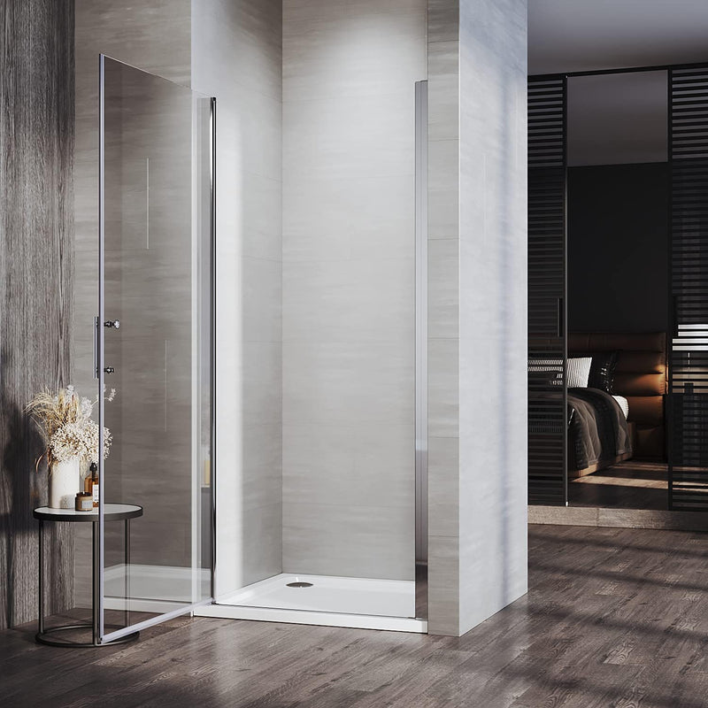 Angled view of chrome frameless pivot shower door with polished chrome fittings