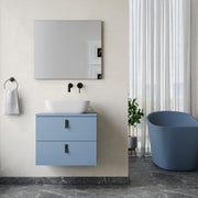 Wall hung vanity unit powder blue – close‑up of matt black handles and powder‑blue lacquered drawer front on Banyetti Invicta unit