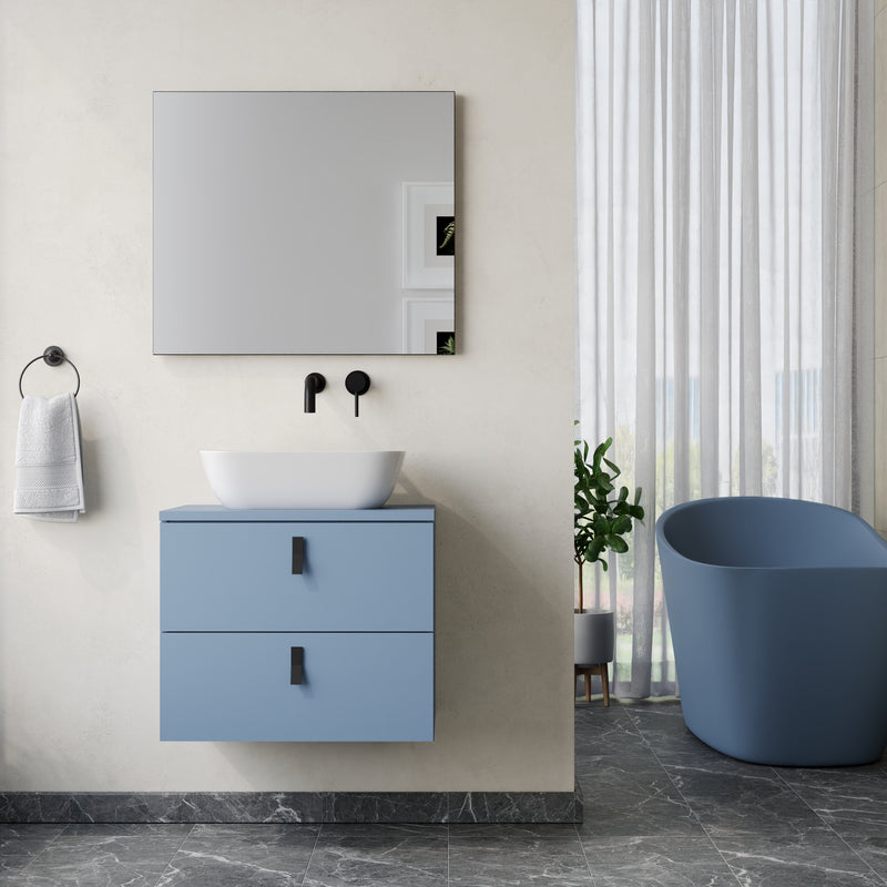 Wall hung vanity unit powder blue – close‑up of matt black handles and powder‑blue lacquered drawer front on Banyetti Invicta unit