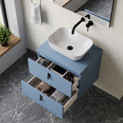 Wall hung vanity unit powder blue – front view of Banyetti Invicta powder‑blue wall‑hung vanity unit with matt black handles