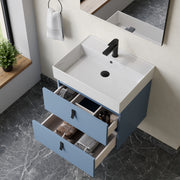 Wall hung vanity unit powder blue – close‑up of matt black handles and powder‑blue lacquered drawer front on Banyetti Invicta unit
