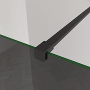 Linea smoked glass walk-in shower screen with black support bar and concealed fixings