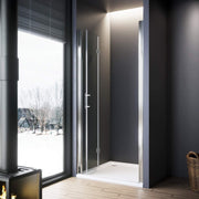 Close-up of polished chrome handle on frameless bifold shower door