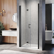 Black frameless bifold shower door installed in a contemporary bathroom