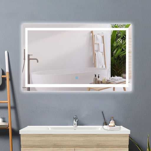 LED bathroom mirror with demister – front view of illuminated rectangular mirror in bathroom setting