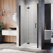 Modern bathroom with black frameless bifold shower door installed