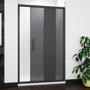 Installed black sliding shower door with smoked glass in contemporary bathroom setting