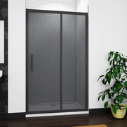 Close-up of matt black sliding shower door showing premium frame, smoked glass and smooth sliding mechanism